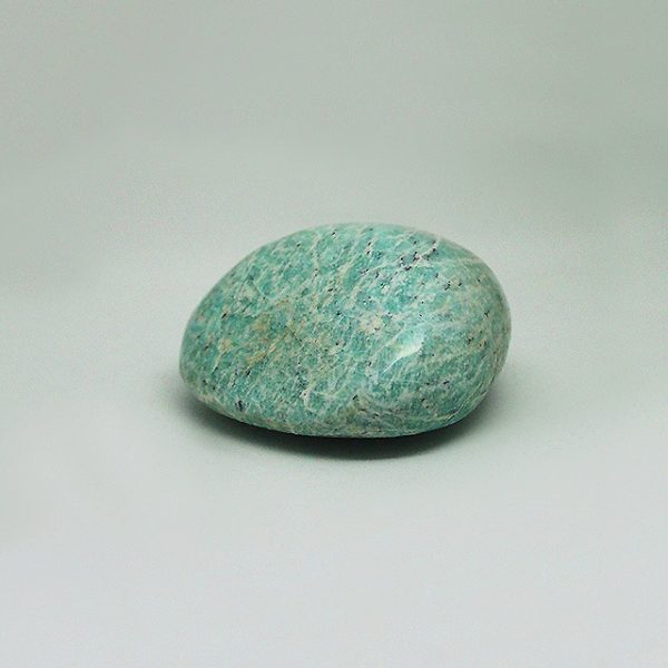 a photo of an amazonite tumbled stone