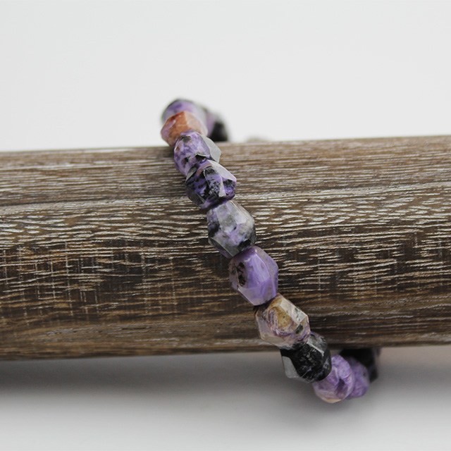 a photo of a charoite bracelet