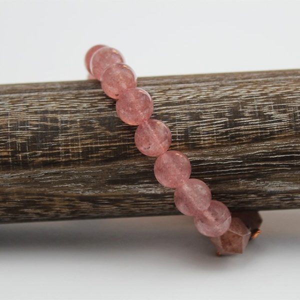 a photo of a strawberry quartz bracelet