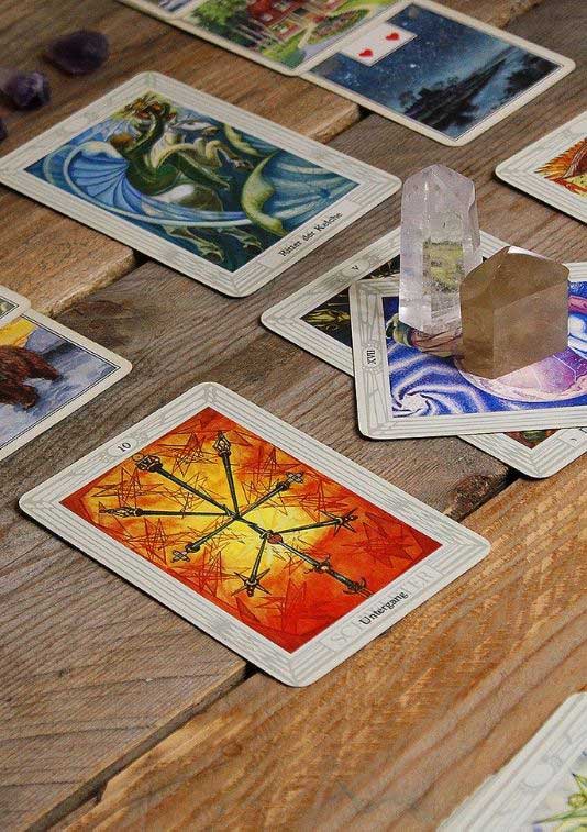a photo of an example of divination with tarot cards and crystals